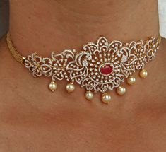 18 karat gold '2 in 1' diamond choker necklace with japanese culture pearls & color stones
  this product has inter changeable stones in the necklace.
  it can also be used as arm patti (armlet)
  length of the arm patti : 10.50 - 16.00 inches
    

introducing the exquisite 18 karat gold '2 in 1' diamond choker necklace with japanese culture pearls & color stones, a true masterpiece crafted by totaram jewelers. this stunning piece of jewelry is designed to captivate and enhance the beauty of ev Diamond Choker Necklace, Diamond Choker, Pearl Color, Japanese Culture, Cultured Pearls, Stone Color, Choker Necklace, 18k Gold, Stone