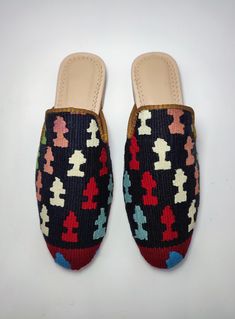 Welcome to AliDesignStore This Kilim Mules one -of-A-kind! Upper Made of a Hand-Selected Vintage Turkish Kilim Rug . Kilims Rugs Are Hand Crafted From Vegetable Yarn. Have Stronger weave. - Handcrafted - Materials : Handwoven Kilim Rug Leather Sole Leather Trimmed Leather Lining Stacked Leather Sole Rubber Under The Stacked Heel Care: Soft Clothing Brush İs Recommended To Clean The Slipper. İf Something Spill on it.You Can Clean İt a Cloth With shampoo. - Ships from a small business in Turkey Casual Multicolor Mules With Rubber Sole, Casual Multicolor Closed Toe Mules, Multicolor Mules With Rubber Sole And Round Toe, Multicolor Closed Toe Mules With Removable Insole, Casual Handwoven Closed Toe Mules, Handmade Casual Mules, Casual Handwoven Slip-on Mules, Artisan Handmade Slip-on Mules, Handmade Casual Mules With Round Toe