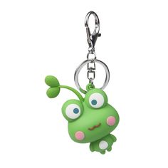 a green frog keychain hanging from a metal hook