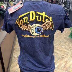 Von Dutch | Shirts | Von Dutch Eyeball So Cal Tshirt | Poshmark Converse Shirt, Versace Shirts, Dutch Blue, Baggy Tee, Grey Converse, So Cal, Von Dutch, Yellow Shorts, Blue Tee