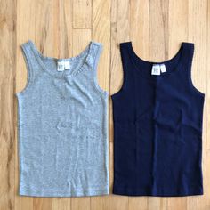 2 Gap Kids Tank Tops, Size Small (6-7), Nwt Navy And Gray Basic Blue School Tops, Basic Blue Tops For School, Basic Cotton Tops For Playwear, Basic Fitted Tops For Playtime, Gap Cotton Tops For Playtime, Navy Cotton Playwear Top, Casual Solid Tops For Playtime, Casual Fitted Tops For Playtime, Gray Cotton Tops For Playtime