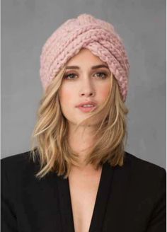 a woman wearing a pink knitted hat