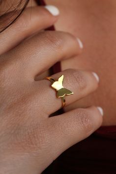 🦋 Explore Our Charming Minimalist Butterfly Ring! 🦋 Elevate your style with this adorable piece crafted from high-quality materials ✨ Choose from 925K Sterling Silver, available in Gold, Rose Gold, or White Gold finishes. Perfect for anyone seeking beauty in simplicity 💙 Details: * Crafted from 925K Sterling Silver, plated with 14K Gold, Rose Gold, or White Gold * Adjustable sizing for a perfect fit * Swift shipping ensures prompt delivery 🚚 * Our commitment to quality ensures durability for Fine Jewelry Midi Rings In Recycled Gold As Gift, Fine Jewelry Midi Rings In Recycled Gold For Gifts, Yellow Gold Open Butterfly Ring For Gift, Recycled Gold Open Ring Stackable Rings As Gift, Handmade Minimalist 14k Gold Midi Rings, Tiny Recycled Gold Rings As Gifts, Recycled Gold Stackable Open Rings As Gift, Minimalist Adjustable Butterfly Ring, Modern Recycled Gold Stackable Rings Gift