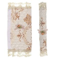 two white and gold wedding garters with lace on them, one is decorated with flowers