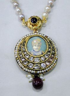 "Vintage antique 22 K solid gold and Ruby pearl Sapphire gemstone Necklace. Original old Royal piece with Maharaja (king)miniature painting inserted in very good condition. Size of pendant-3.5 cm, Length -35 cm(13.77\") end to end, free size easy to adjust the length by moving cord knot. weight-44 grams, material -22 K gold, Ruby, pearls, Sapphire." Traditional Round Pendant Necklace With Gemstone, Traditional Gemstone Round Pendant Necklace, Traditional Temple Necklace With Gemstones, Traditional 22k Gold Kundan Necklace As Gift, Antique Meenakari Jewelry Gift, Antique Meenakari Jewelry As A Gift, Round Pearl Pendant Necklace For Festivals, Traditional Round Necklace With Pearl Pendant, Hallmarked Traditional Kundan Necklace As Gift