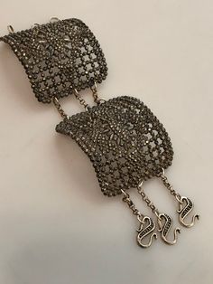 "Just purchased this double Art Deco CUT STEEL shoe Buckle Bracelet at an estate. This one is different than most of what I have seen because it was made with 2 buckles instead of one. The bracelet measures 6.5\" which includes the chain, not the hooks. You might need someone to put it on for you as it is a little tricky but once on, its very comfortable. The inside of the buckles are a little rough where the actual piece of metal was removed that held the buckle onto the shoe. Once on, however, Metal Party Brooch, Ornate Bracelet Jewelry For Parties, Unique Evening Bracelet Jewelry, Antique Adjustable Bracelets For Parties, Antique Adjustable Bracelets For Party, Adjustable Handmade Bracelets For Evening, Handmade Evening Bracelet Jewelry, Adjustable Metal Bracelets For Evening, Adjustable Costume Jewelry Bracelets For Evening