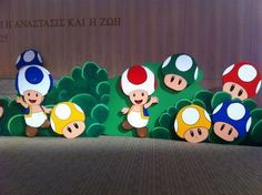 paper cutouts of mario and mushroom characters on display