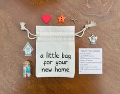 a little bag for your new home is on the table next to it's contents