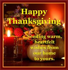 a happy thanksgiving card with candles and flowers