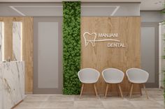 three white chairs in front of a wooden wall with the words manzani dental on it