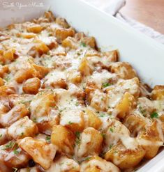 a casserole dish filled with chicken and cheese