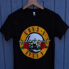 Guns And Roses Graphic Rock Tshirt Brand New Made To Order 100% Cotton True To Size Any Questions Feel Free To Send A Message And Thanks For Looking :) Streetwear Crew Neck T-shirt With Rose Print, Black Crew Neck T-shirt With Rose Print, Black Short Sleeve T-shirt With Rose Print, Streetwear Rose Print Crew Neck T-shirt, Black Rose Print Short Sleeve T-shirt, Black Cotton T-shirt With Rose Print, Rock Graphic Tees, Def Leppard Shirt, Roses Graphic