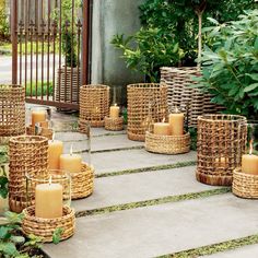 wicker candles are arranged on the steps outside