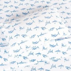 a sheet set with blue sharks on it