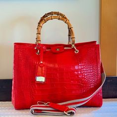 This Stunning Crimson Red, Croc Embossed Italian Leather Bag Is Large, Allowing For Multiple Uses As A Satchel, Shoulder Bag, Or Weekender. Nwot Faux Bamboo Satchel Handles With Separate Cloth And Leather Shoulder Strap + Fab Silver Hardware Triple Compartmet Center Zip And Snap Closure Very Roomy - Plenty Of Space For Laptop, Water Bottle, Etc. Nwot - Received As Gift - Never Used - No Known Flaws Approx Measurements: 15.25 X 11.25 X 7 (Grab It Now Before I Change My Mind!!) From Smoke Free, Pe Red Luxury Shoulder Bag For Daily Use, Red Luxury Bags With Leather Handles, Luxury Red Bags With Leather Handles, Luxury Red Shoulder Bag With Handles, Luxury Red Satchel For Daily Use, Designer Red Satchel With Double Handle, Red Luxury Satchel With Leather Handles, Luxury Red Satchel With Leather Handles, Luxury Red Bags For Everyday Use