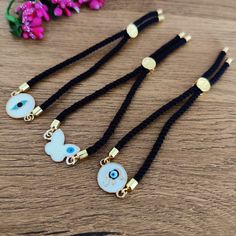 ✨ Heriyan Handcrafted Evil Eyes Rakhi / Evil Eye Bracelet ✨ ✍🏽 Evil's eye is a symbol considered for saving us from negative energies, these rakhis are specially handcrafted for beloved brother who has been a strongest support throughout... ✍🏽 The size is adjustable as these are ready for you to tie on your brother! We keep the cord long to fit all arm sizes (approx. 24cm) ✍🏽 We use beautiful high quality Adjustable Black String and Evil Eye Charms. ✍🏽 Tie your Brother this Wonderful and fab Traditional Resizable Bracelets As Gift, Traditional Resizable Jewelry For Friendship, Traditional Jewelry Gift With Adjustable Length, Adjustable Traditional Evil Eye Bracelet, Traditional Jewelry With Adjustable Length As Gift, Traditional Adjustable Evil Eye Bracelet, Traditional Black Friendship Bracelets As Gift, Traditional Jewelry As A Gift With Adjustable Length, Traditional Black Friendship Bracelet As Gift