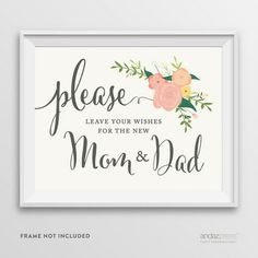 a framed sign that says please leave your wishes for the new mom and dad