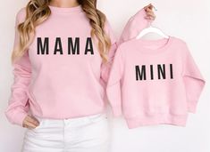 "Matching Mama and Mini Sweatshirts, Mama Sweatshirt, Mother Daughter Shirts, Best Gifts for Moms, Matching Mommy and Me Sweaters, Toddler H O W T O O R D E R 1. Simply select the size of your shirt individually and then click \"Add to Cart\" 2. Repeat each step for each shirt that you need. Add as many as needed to your cart and then proceed to checkout. 3. Submit order ♥ The items are printed after the payment has been cleared within 1-3 business days, sometimes faster. This is the time when t Pink Long Sleeve Slogan Top, Pink Long Sleeve Top With Slogan, Family Matching Pink Tops For Fall, Basic Long Sleeve Pink T-shirt, Pink Long Sleeve Sweatshirt With Name Print, Pink Long Sleeve T-shirt With Name Print, Mother's Day Casual Crew Neck Tops, Matching Pink Tops With Letter Print, Pink Matching Tops With Letter Print