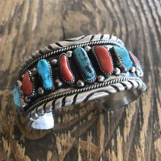 Pre-Owned * Jewelry Type : Bracelets * Tribal Affiliation : Navajo * Main Stone : Turquoise * Metal : Sterling Silver * Featured Refinements : Navajo Sterling Silver Jewelry * Material : Coral * Style : Cuff * Lot : No Oldie But A Goodie! Vintage Natural Red Coral Turquoise Sterling Silver Bracelet Cuff. Check Out The Colors In These Incredible Stones. Measuring Inside Circumference Is 5 3/4 Inches With A 1 1/2 Inch Gap. Width Is 1 1/2 Inches. Weight 104 Grams. Very Cool Vintage Find! Thank You Southwestern Red Gemstone Jewelry, Southwestern Style Red Gemstone Jewelry, Southwestern Multi-stone Cuff Bracelet, Southwestern Multi-stone Cuff Bangle Bracelet, Southwestern Multi-stone Bangle Cuff Bracelet, Red Southwestern Cuff Bracelet Gift, Red Southwestern Cuff Bracelet As Gift, Handmade Red Sterling Silver Cuff Bracelet, Red Sterling Silver Bangle Cuff Bracelet