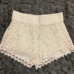 Nwot A Pair Of Jr's Cream Crochet, Lace Overlay Shorts By Ambiance Apparel. Size: Large * Elastic Wide Waistband * Self: Cotton/Nylon * Solid Soft Lining: 100% Polyester Approx Measurements Laying Flat * Length Front 12" Back 12.5" * Waist 14’ Bohemian Fitted White Shorts, White Fitted Bohemian Shorts, Bohemian White Fitted Shorts, Casual Summer Bottoms With Lace Patchwork, Casual Lace Patchwork Bottoms For Summer, Chic Lace Shorts With Lace Trim, Summer White Bottoms With Lace Patchwork, White Bottoms With Lace Patchwork For Summer, Summer Lace Bottoms With Lace Patchwork