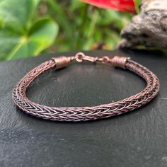 Entirely designed and created by myself this intricate double Viking knit chain bracelet is also made from upcycled materials.  The weave is woven from recycled 24 gauge copper wire. The end caps  finishing each side of the chain are made from upcycled copper wire as well as the links and hook clasp.  The bracelet is flexible and comfortable to wear , it comes with a antique patina and hand polish finish to make details stand out.  *upcycled *handmade  *gift box *polishing cloth included  🌺 Han Wire Wrapped Chain, Knit Bracelet, Viking Knit, Jewelry For Men, Hook Clasp, Chain Jewelry, Kauai, Copper Wire, Wire Jewelry