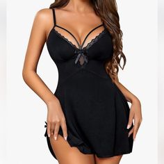 This Babydoll Nightgown Is Made Of High-Quality Lace And Modal, Ensuring A Smooth, Stretchy, And Lightweight Feel That Is Incredibly Comfortable To Wear At Night. The Soft And Breathable Fabric Adds To Its Charm And Sexiness, Providing A Comfortable Wearing Experience. Featuring A Deep V-Neck Lace Design, This Babydoll Nightgown Fits Perfectly On Your Chest And Accentuates Your Charming Breast Curve. It Is A Must-Have Suspender Underwear That Adds Allure To Your Wardrobe. The Flowy Bottom With E Black Flirty Loungewear Sleepwear, Night Sleepwear With Lace Trim And Underwire, Black Camisole Nightgown For Wedding Night, Coquette Style Camisole For Night, Black Flirty Sleepwear, Flirty Black Sleepwear, Black Coquette Sleepwear For Wedding Night, Flirty Black Sleepwear For Night, Black Coquette Nightgown For Bedtime