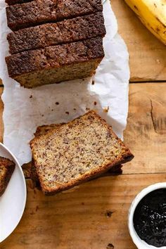 slices of banana bread sitting on top of a wooden table