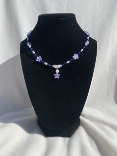 Dark blue with a hint of purple necklace. Perfect for a star and space lover. Purple Star Necklace, Trendy Blue Star-shaped Jewelry, Trendy Star-shaped Blue Jewelry, Trendy Blue Star Shaped Jewelry, Blue Star-shaped Beaded Necklace, Blue Star-shaped Adjustable Necklace, Handmade Blue Star-shaped Beaded Necklaces, Adjustable Blue Star-shaped Beaded Necklace, Handmade Blue Star Beaded Necklaces