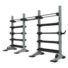 two black racks with one shelf and the other is holding several pairs of racking