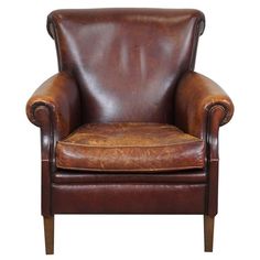 a brown leather chair on a white background