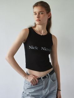 This sleeveless piece from NICK&NICOLE features a vintage logo print as its main highlight. Made with a spandex blend, it offers a comfortable fit and feel.- Cropped length that makes your look stylish- Stylish when worn on its own and as a layered inner- A fundamental item for any wardrobe Fitted Sleeveless Vest With Graphic Print, Stretch Sleeveless Vest With Letter Print, Stretch Cotton Vest With Letter Print, Fitted Cotton Tank Top With Logo Print, Fitted Tank Vest With Letter Print, Trendy Fitted Vest With Graphic Print, Fitted Letter Print Tank Vest, Trendy Fitted Crew Neck Vest, Basic Graphic Print Sleeveless Tank Top