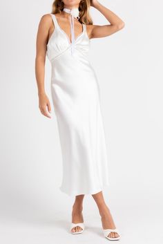 Giving us angel energy with a bit of spice. The Ethereal Slip Dress is the dress of the season! Made from satin with lace trim, open back detail and a midi length. Color: White Satin Midi Length Lace Trim Open Back With Button Closure Polyester Lined Model Is 5'5", 24/25 Waist, 32A Bust & Wearing Size Small Satin Midi Length Dresses With Lace Trim, Elegant Dress With Satin Trim For Night, Wedding Night V-neck Dress With Satin Finish, Summer Satin Midi Dress With Lace Trim, Elegant Night Dress With Satin Trim, White Satin Finish Dress With Spaghetti Straps, Backless Satin Slip Dress For Night, Satin Sleep Dress With Spaghetti Straps, Satin Midi Dress With Lace Trim