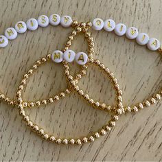 Item Overview Handmade Item Material: Gold Filled. Made To Order. Only Ships To United States From Florida. Personalizable, Please Message Me Your Word Or Name Of Your Choice At Tacangel@Aol.Com Item Details: Gold Filled 4mm Beaded Bracelet With Name Or Word Of Your Choice. Letter Beads Have A White Background With Gold Letters. Each Bracelet Can Be Personalized With A Name Or Word Of Your Choice Along With Your Desired Length. These Bracelets Are 14k 4mm Gold Filled And Will Not Tarnish, And Lo Bracelet With Name, Beaded Name Bracelet, Name Bracelets, Your Word, Letter Beads, Name Bracelet, Gold Letters, Beaded Jewelry Diy, White Beads