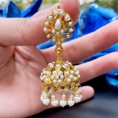 Featured are a pair of pearl Jhumkis made in 92.5 gold plated silver. All pearls used are precious freshwater pearls. The Jhumkis are comfortable to wear, weighing about 25gms. Temple Bridal Earrings In 22k Gold With Cutdana, 22k Gold Cutdana Bridal Earrings In Temple Jewelry Style, 22k Gold Bridal Earrings With Cutdana In Temple Style, Temple Style Pearl Earrings With Latkans For Festivals, Temple Jewelry Pearl Earrings With Latkans For Festivals, Festive Temple Jewelry Pearl Earrings, 22k Gold Chandbali Jhumkas With Tilla, Bollywood Pearl Chandbali Jhumkas, Festive Pearl Jhumkas