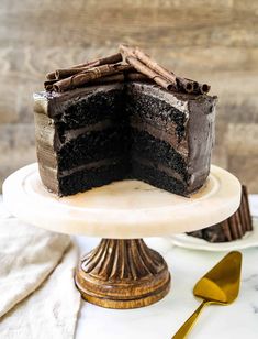 a chocolate cake sitting on top of a white plate