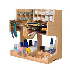 a crafting kit with scissors, thread, glue and other items in the holder