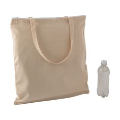 a tote bag and water bottle sitting next to each other