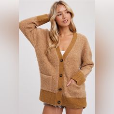 This Fuzzy Fabric Cardigan Is A Cozy And Stylish Piece Of Clothing. It Features A Button-Up Front, A Design Element That Offers A Timeless Look And Makes It Easy To Wear. The Cardigan Also Includes Long Sleeves, Providing Warmth And A Polished Look. The Design Is Completed With Ribbed Cuffs And A Hemline, Which Not Only Ensure A Snug Fit But Also Add A Textural Contrast To The Overall Design, Enhancing Its Visual Appeal. Additionally, The Cardigan Is Designed With Two Patch Pockets, A Practical Brown Button Up Cardigan Outfit, Beige Button-up Soft Knit Outerwear, Beige Soft Knit Button-up Outerwear, Brown Cardigan With Button Closure For Everyday, Everyday Brown Cardigan With Button Closure, Cozy Beige Cardigan With Buttons, Cozy Beige Buttoned Cardigan, Cozy Beige Button-up Sweater, Everyday Brown Soft Knit Cardigan