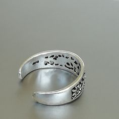 A filigreed Egyptian style silver toe band 6 mm wide. This is an open ended toe ring and can be adjusted to fit most feet. These toe rings are made of 925 hypoallergenic sterling silver. Please note this price is for ONE toe ring only. Can be sent in a gift box. I can include a personal message from you if needed You are welcome to contact me at... bhavnakwintra1956@gmail.com For more beautiful pieces from my shop, please browse 👇 TOE RINGS: https://www.etsy.com/your/shops/TheSilverGame/tools/l Adjustable Silver Metal Toe Rings, Silver Metal Open Toe Rings, Silver Open Ring Toe Rings, Silver Metal Toe Rings As Gift, Silver Adjustable Toe Rings Stamped 925, Adjustable Silver Toe Rings Stamped 925, Silver Toe Rings Stamped 925 Open Ring, Handmade Silver Open Toe Ring, Silver 925 Stamped Toe Rings For Gift