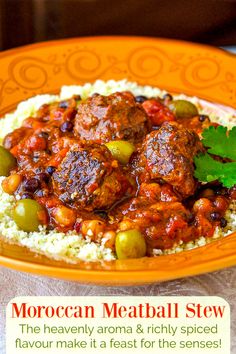 an orange plate topped with meatballs and rice