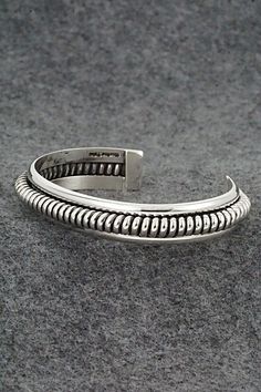 This amazing, brightly polished sterling silver bracelet was made by Navajo silversmith Ben Tahe. The back is signed Tahe and stamped sterling.Size: 5 1/4" (will fit a 6 1/2" wrist)Gap: 1 1/4"Width: 1/2"Free shipping on all orders! We ship with USPS and always include tracking. All orders ship within a day of payment.Returns are accepted up to 30 days after you receive your order. Just send us a message. Our shop offers cash back or store credit. The item must be returned in new condition. Bear Carving, White Buffalo, Pearl Chain, Sterling Silver Bracelet, Native American Jewelry, Free Jewelry, Sterling Silver Bracelets, White Vintage, Jewelry Gifts