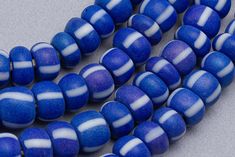 "Vintage Large glass seed beads. These have a matte blue and white color with a denim tone. There is lovely variation of color, shape and size within the strand that you get with the older beads. Wonderful for a more organic tribal feel. 100 beads 24\" of beads - 60cm 8-9mm diameter 2.5-3mm hole" Blue Polished Beads For Beach, Ghana Beads, Vintage Blue And White, Glass Seed Beads, Pony Beads, Ghana, Live Lokai Bracelet, White Color, Seed Beads