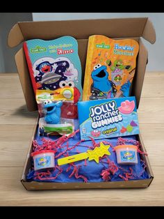 an open box with toys inside on a table