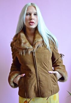 Brown faux shearling coat with faux fur. Fastened with a zipper. It has 2 pockets on the front. The sleeves and collar are finished with faux fur. The jacket is very warm Brand: FEIFA Size - S MEASURMENTS:  length - 61 cm sleeves - 63 cm chest - 49 cm x 2 waist: 47 cm x 2 Material: no label Condition: Very Good  All items are vintage and may show some signs of wear. We carefully select items in the best condition and we will inform you if there was any flaws. The model in this pic is 170 cm and usually wears size XS/S clothes. Sending out next 2 business days. Be sure to contact us with any questions. Cukier Puder Vintage Store Winter Faux Fur Coat With Zipper Closure, Fall Fur Coat With Zipper Closure For Cold Weather, Faux Fur Coat With Zipper For Cold Weather, Brown Fur Coat With Zipper For Winter, Retro Long Sleeve Fur Coat For Winter, Retro Long Sleeve Winter Fur Coat, Retro Fur Coat With Faux Fur Lining For Fall, Retro Fitted Fur Coat With Faux Fur Trim, Retro Fall Fur Coat With Faux Fur Lining