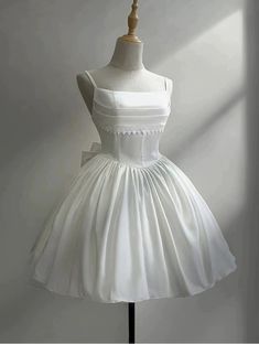 a white dress on a mannequin dummy