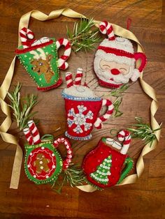 christmas ornaments are arranged on a wooden table