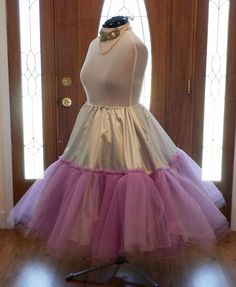 This crinoline petticoat is made to match your wedding dress colors or your wedding colors. The pictures shown are for a silver and lavender fall wedding. I can make this crinoline in most any color combination that is available in fabrics. This crinoline is best suited for 1950s 50s swing dresses that are very voluminous and very full. Makes a gorgeous accessory to your reception dancing 50s swing dresses brides . The crinoline base fabric is bridal satin. The tulle is a very stiff crinoline tu Tiered Ruffle Petticoat For Costume Party, Ruffled Tiered Skirt Petticoat For Costume Party, Ruffled Tiered Petticoat For Costume Party, Party Petticoat With Ruffled Crinoline Skirt, Costume Party Full Tulle Petticoat, Vintage Full Skirt Petticoat For Costume, Full Tulle Petticoat For Costume Party, Spring Can-can Petticoat In Crinoline, Tulle Ruffled Petticoat For Costume Party