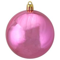 a pink ornament hanging from a gold chain