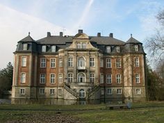 an old building with many windows and stairs