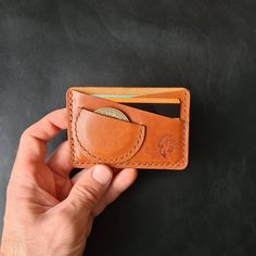 "*Please leave me a note (diameter of your coin) when placing an order If you need a custom size slip for a smaller or bigger coin. The coin used in photos is 38-39mm in diameter. This Minimalist EDC Wallet is fully handcrafted as all of my products. The wallet fits comfortably in your front pocket. The material: The edc card wallet is made of 3-4 oz (1,2-1,6mm) vegetable tanned leather. This durable leather will not only endure but get better with age. The Wallet has: - 2 Card slots that can ca Challenge Coin Wallet, Edc Wallet, Fisher Space Pen, Wallet With Coin Pocket, Air Tag, Leather Cases, Wallet Minimalist, Coin Card, Coin Wallet